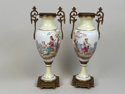pair of antique vases with hand painted scenes on them