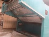 a blue metal staircase in a building with a blue wall