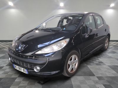 a picture of a small black car parked in a garage