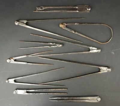 several different types of surgical instruments are arranged on a table