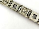 a silver bracelet that has a metal clasp on it