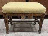 a small bench with a yellow upholstered seat