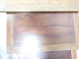 a close up of a wooden table with a clock on it