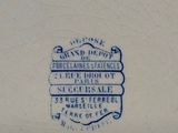 a blue and white plate with a blue and white design on it