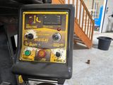 a machine that is sitting on the ground in the garage