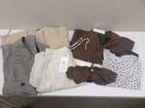 a table with a lot of clothes on top of it