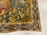 a picture of a tapestry with birds and flowers on it