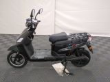 a scooter that is parked on a checkered floor