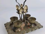 a silver plate with spoons and spoons on it