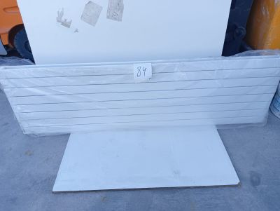 a picture of a white refrigerator sitting on top of a pallet