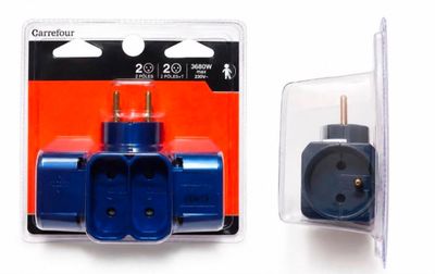 two plugs in a package on a white surface