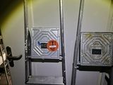 two ladders that are next to each other in a room