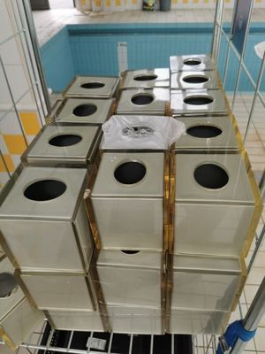 many boxes stacked on top of each other in a room