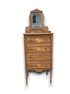 an image of a dresser with a mirror on top of it