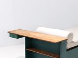 an image of a bed with a wooden frame and white sheets on it