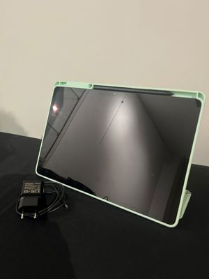 a laptop computer sitting on a table with a mouse on it
