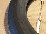a tire that is sitting on a cardboard box