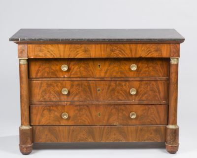 an antique chest of drawers with marble top