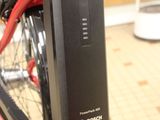 a close up of a bike with a red handlebar
