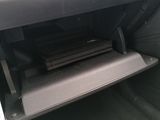 the interior of a car with a radio in the center of it