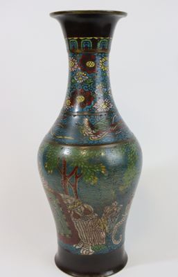a vase that has a picture of a dragon on it