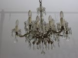 a chandelier hanging from the ceiling in a room