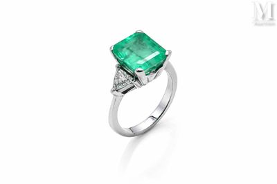 an emerald and diamond ring