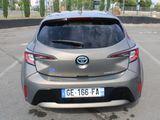 the rear of a silver toyota c - hr parked in a parking lot