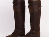 a pair of brown boots with buckles and straps on them