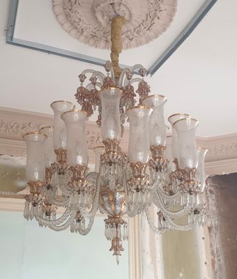 a chandelier with many glass vases hanging from the ceiling