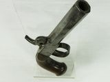 an old gun that is on display in a glass case
