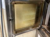 a microwave that is open in the kitchen