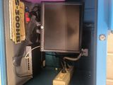 a small blue cabinet with a tv inside of it