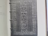 an open book with a black and white image of a pattern on it