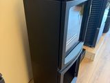 a small television sitting on top of a black cabinet