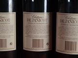 three bottles of wine sitting on top of a table next to each other