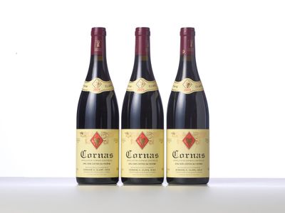 three bottles of wine sitting on top of a table