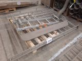 a metal bed frame on a pallet in a warehouse