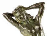 statue of a male nude torsoed man holding his hands behind his head