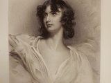 portrait of a woman in a white dress with a shaw around her neck
