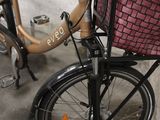 a bicycle that has a basket on the back of it