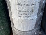 a roll of plastic wrapped around a green planter