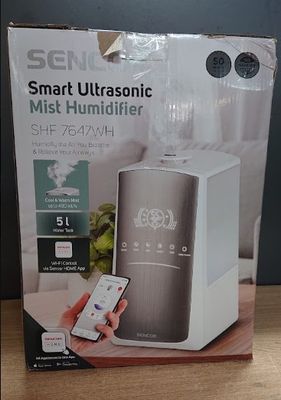 Emballage d'un humidificateur à ultrasons intelligent posé sur une table en bois