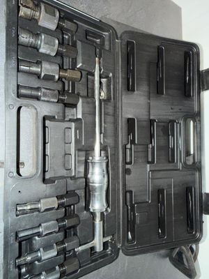 a tool kit in a black case on the wall
