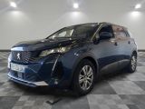 a blue car is parked in a room with a checkered floor
