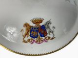 a plate with a picture of a horse and a lion on it