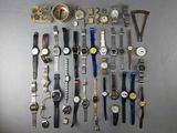 a lot of watches that are sitting on a table