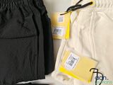 a pair of black and white pants and a pair of scissors on a table
