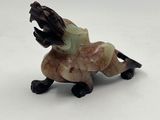 an image of a figurine of a dog with its mouth open