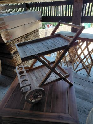 a wooden chair that is sitting on a porch